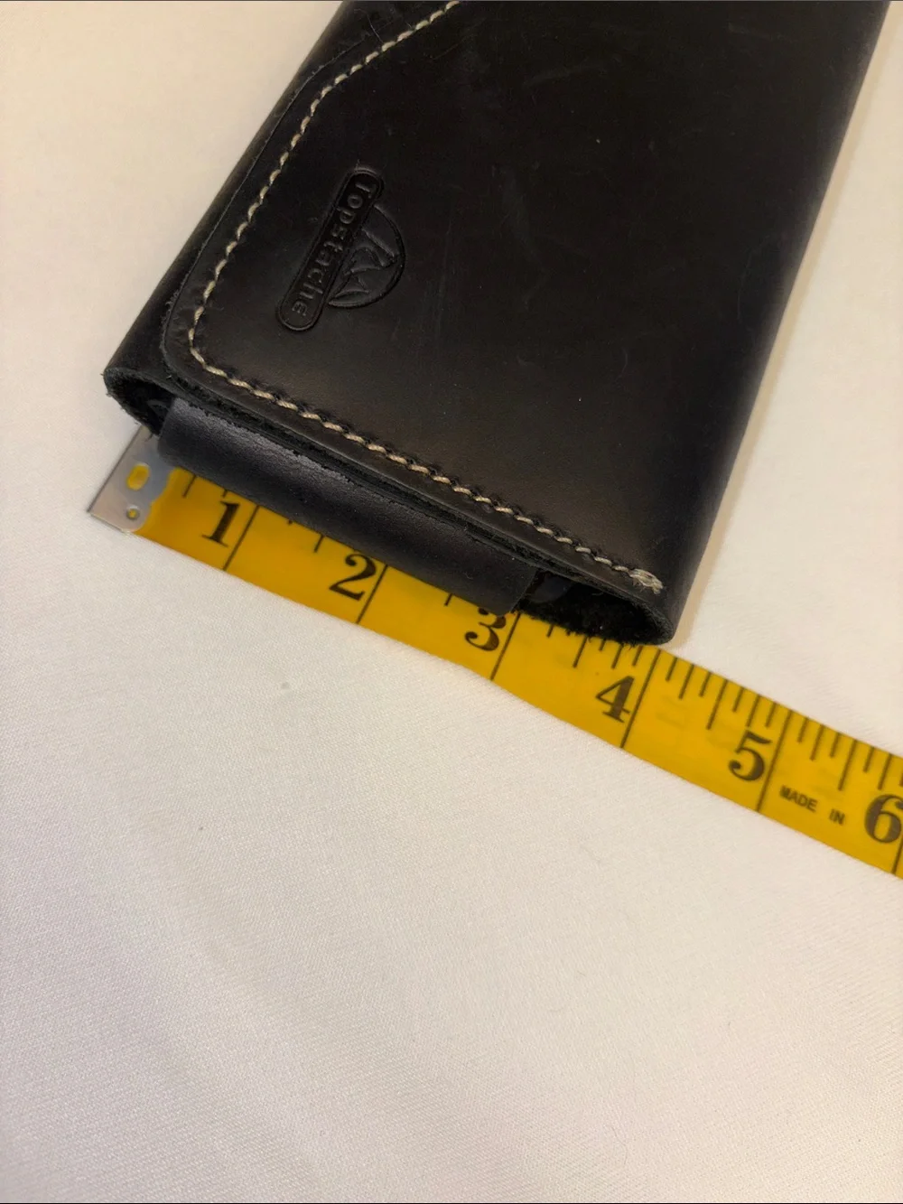 Cellphone case made to fit on belt magnetic closure inside pocket for cards